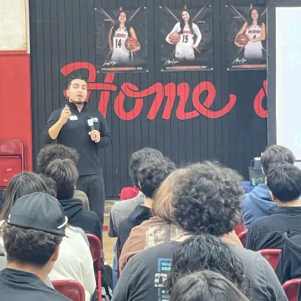 Steward Pimienta, Travis Credit Union’s youth engagement officer, addresses students at Winters High School as part of TCU’s Generation Wealth interactive youth financial education initiative on Feb. 28.