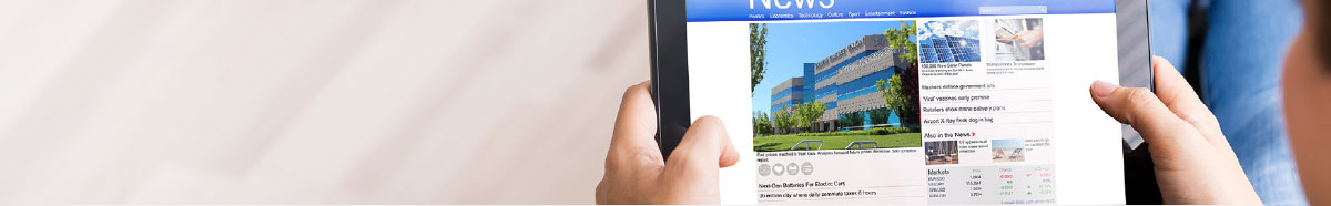 photo of a tablet device with News website